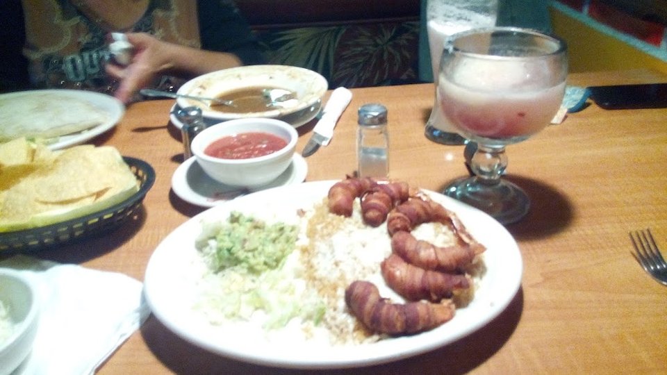 Restaurant menu featuring plates, drinks, and sampler options.